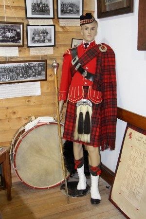 Mannequin of a Strathtaieri piper in the Matheson tartan, in the Middlemarch Museum