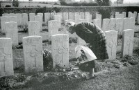 Alex's sister Alice visiting his grave near Messines in Belgium